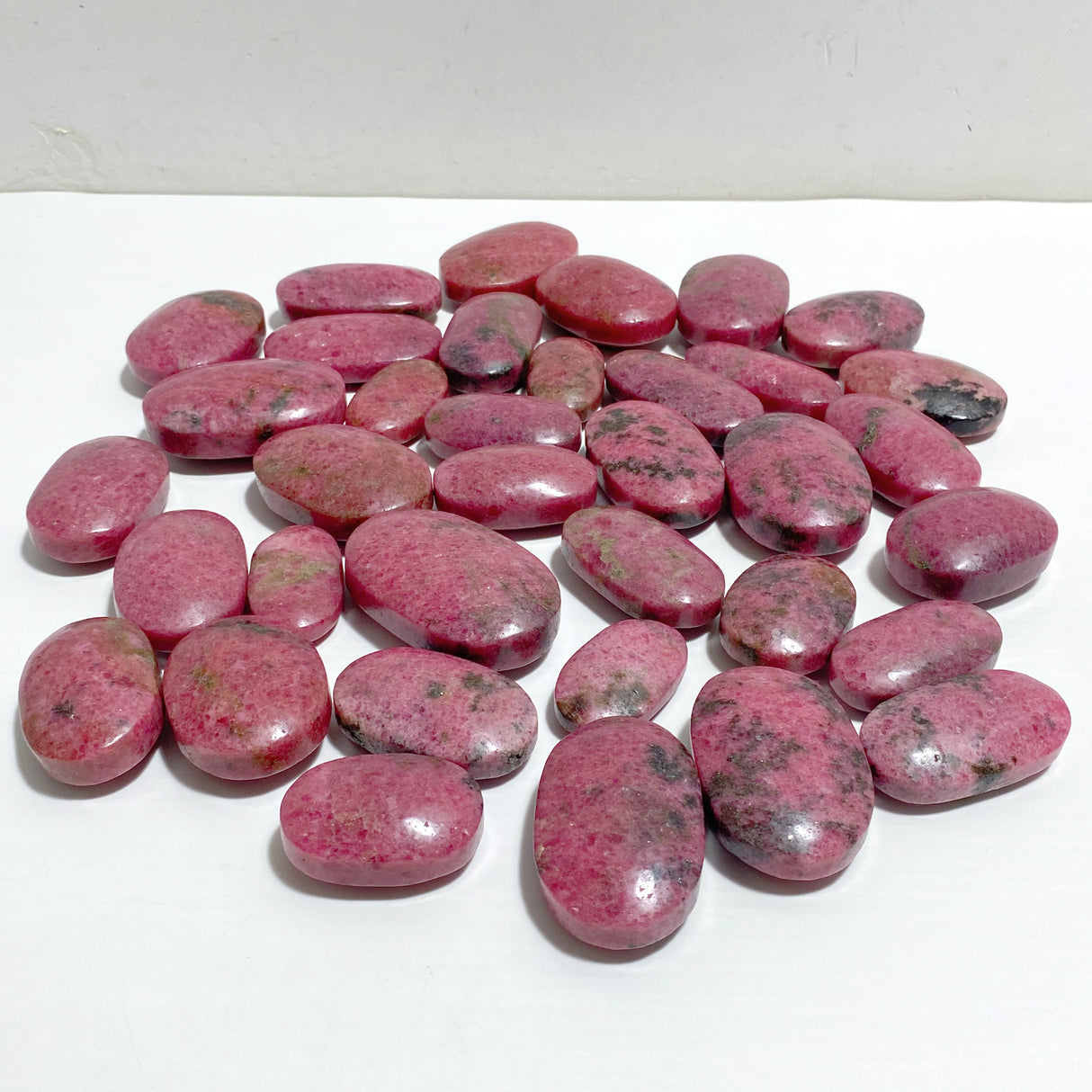 High Quality Rhodonite Palm Stone Wholesale