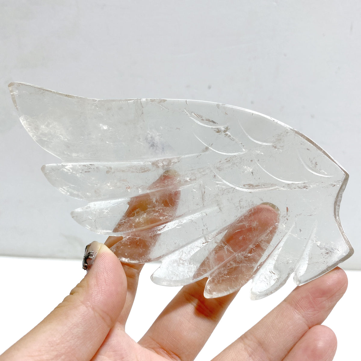 Clear Quartz Heart Wing Carving With Stand