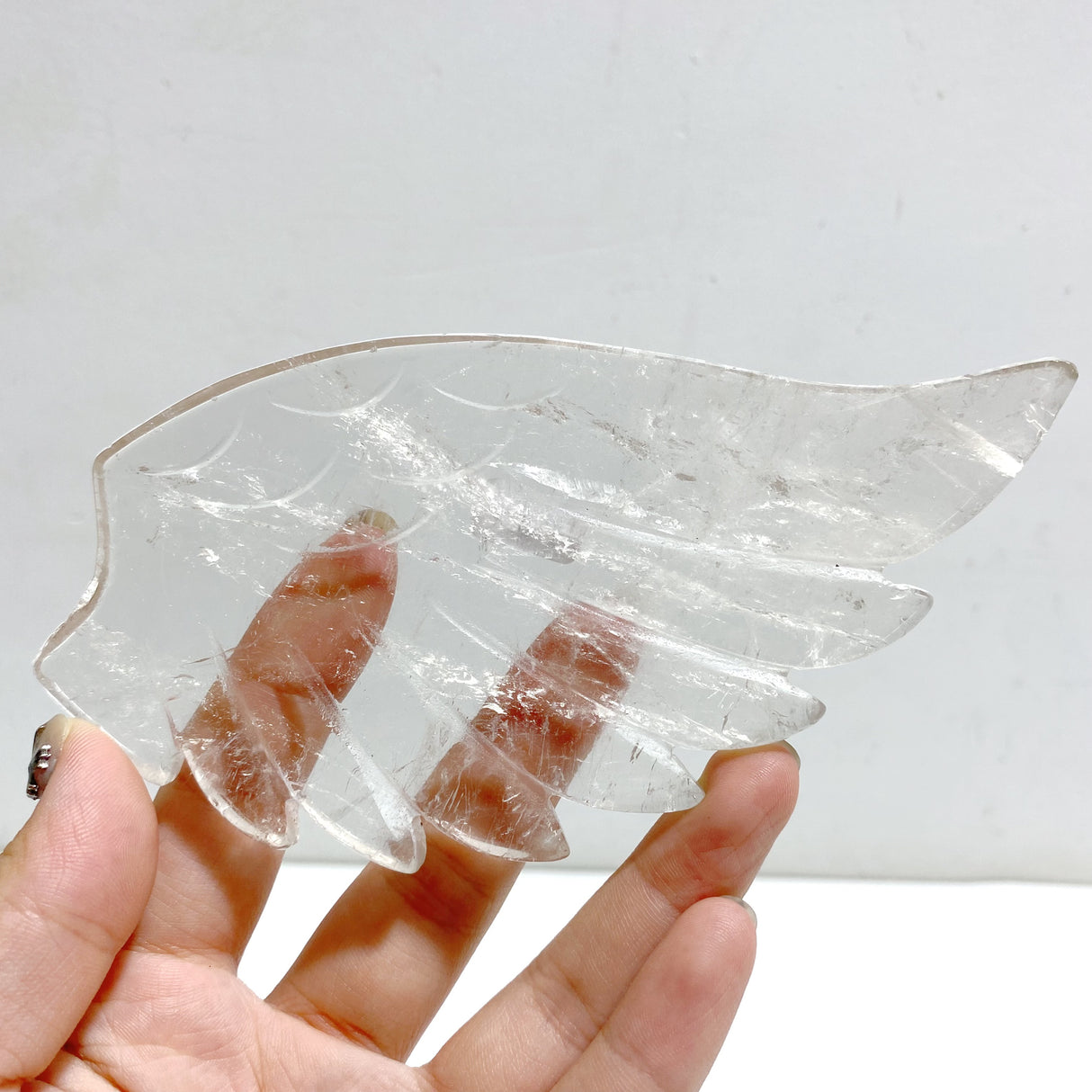 Clear Quartz Heart Wing Carving With Stand